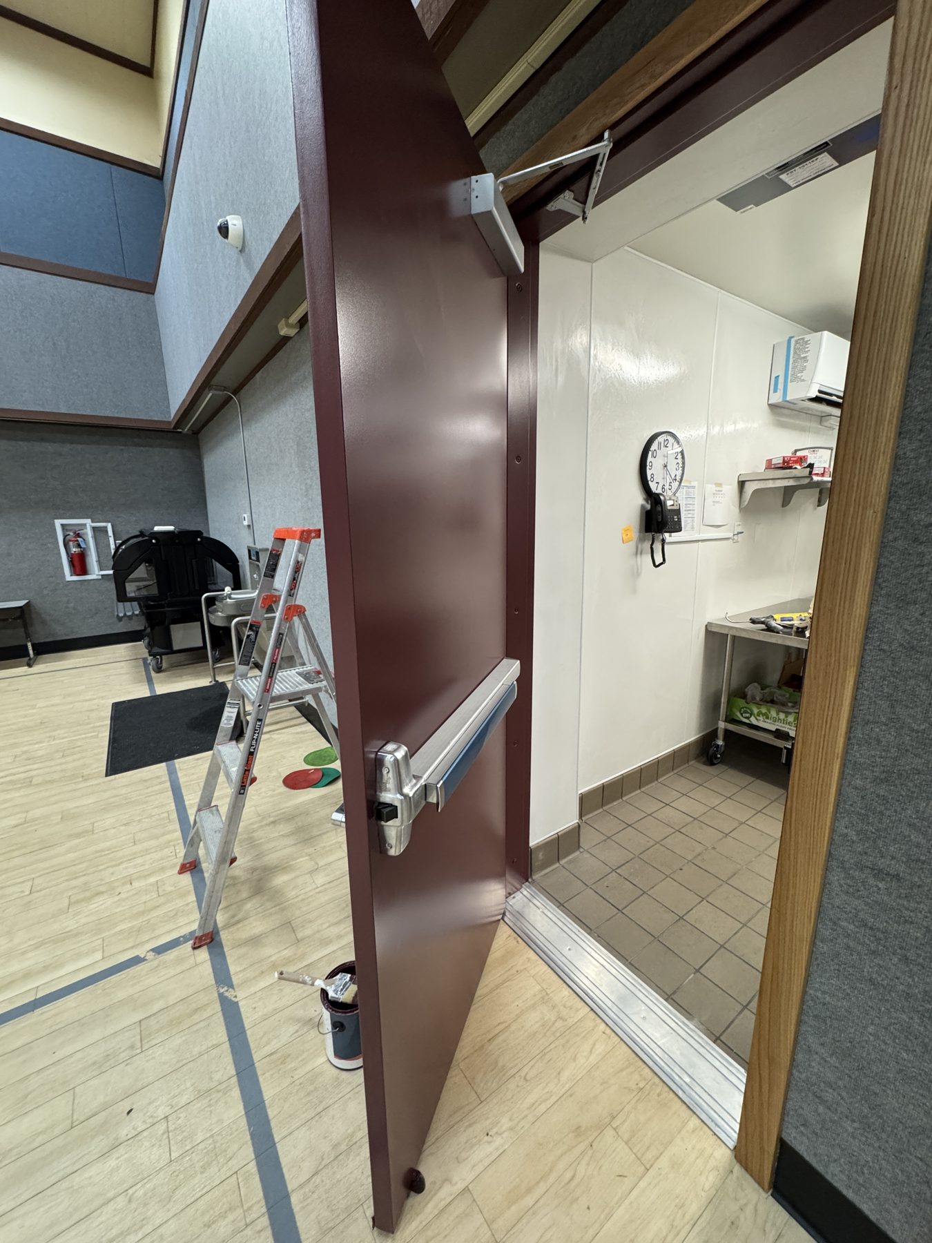Freshly painted steel door and frame at a Sacramento-area facility